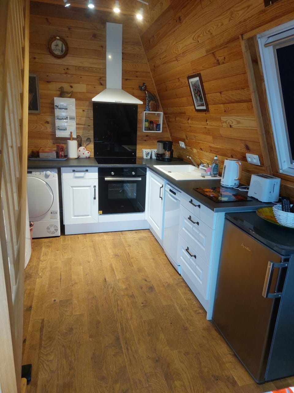 Kitchen or kitchenette, dishwasher, oven, stove