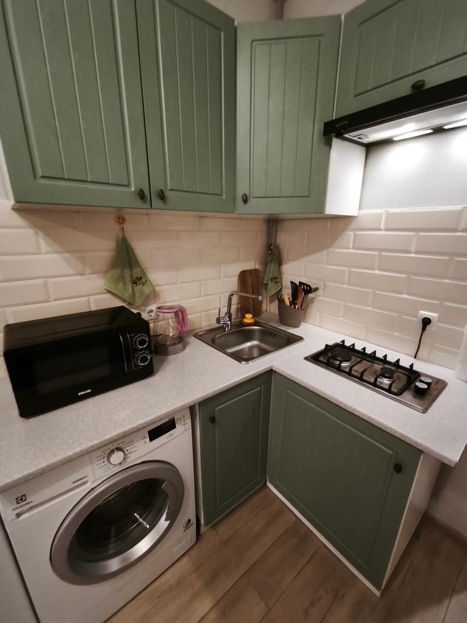 Kitchen or kitchenette, microwave, stove, washing machine