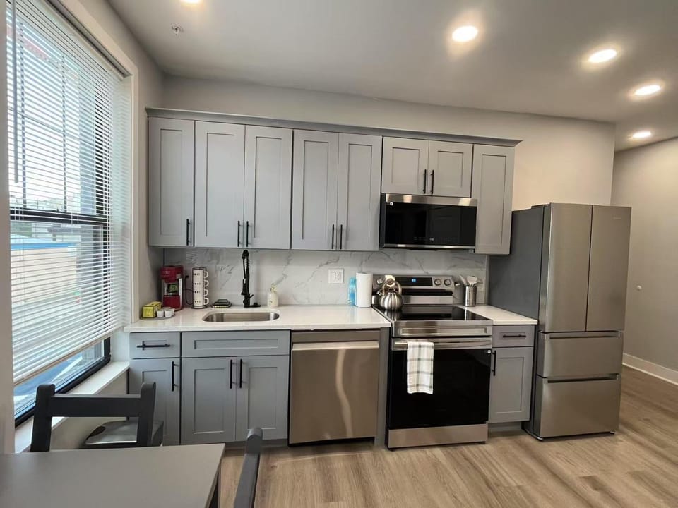 Kitchen or kitchenette, dishwasher, oven, stove