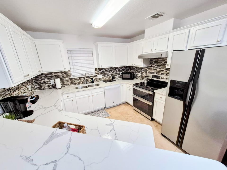Kitchen or kitchenette, dishwasher, oven, stove, toaster