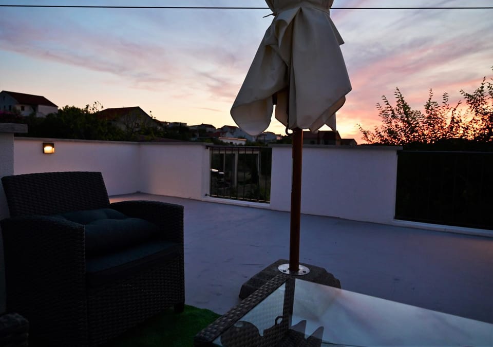 View (from property/room), Balcony/Terrace, Seating area, Sunset