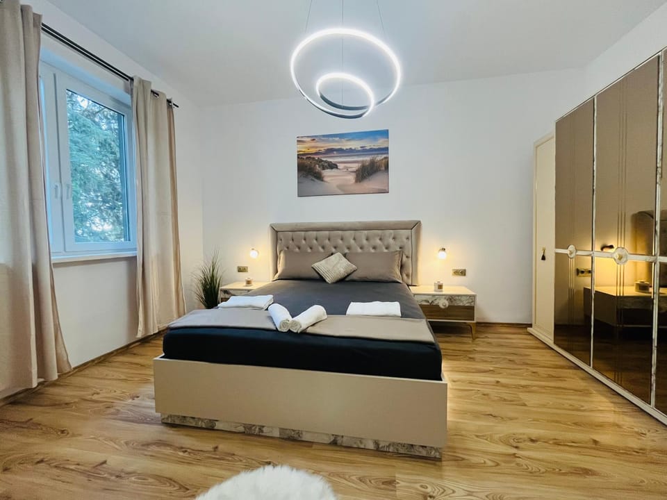 Bed, towels, wardrobe