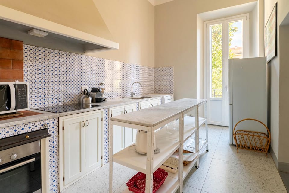 Kitchen or kitchenette, dishwasher, oven, stove