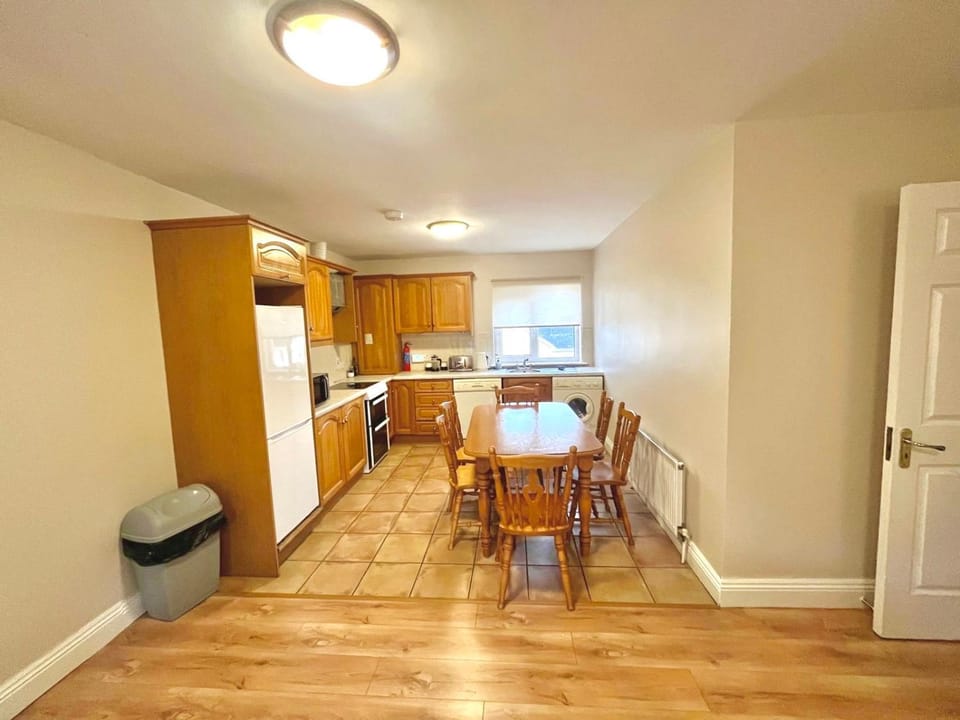 Kitchen or kitchenette, dishwasher, oven, stove