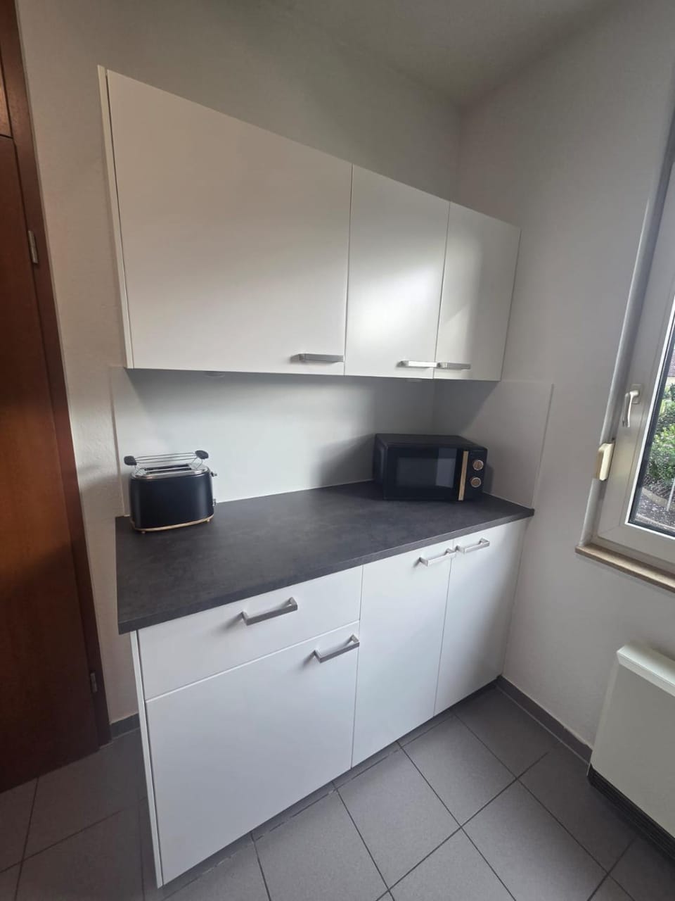 Kitchen or kitchenette, microwave, toaster