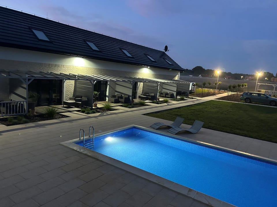 Property building, Night, Pool view, Swimming pool, sunbed