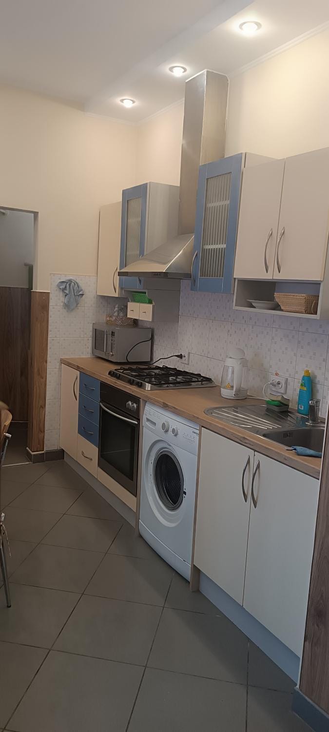 Kitchen or kitchenette, oven, stove, washing machine