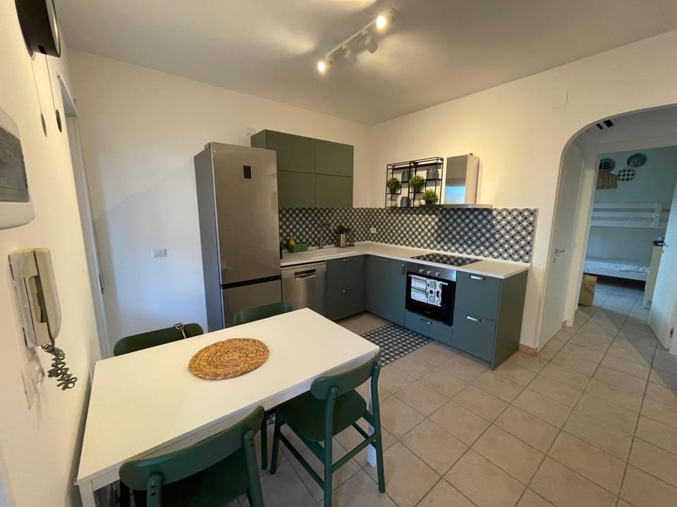 Kitchen or kitchenette, dishwasher, oven, stove