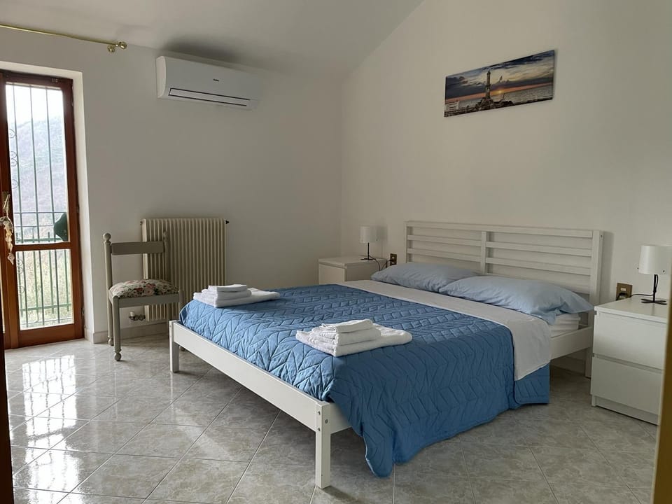 Bed, Balcony/Terrace, Bedroom, towels, air conditioner