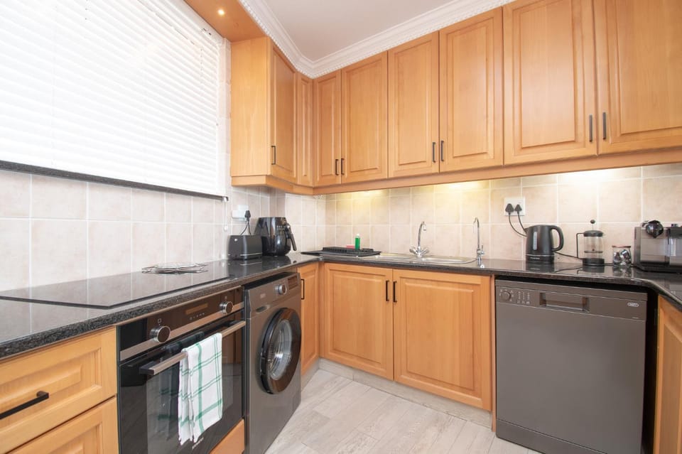 Kitchen or kitchenette, dishwasher, oven, stove, toaster