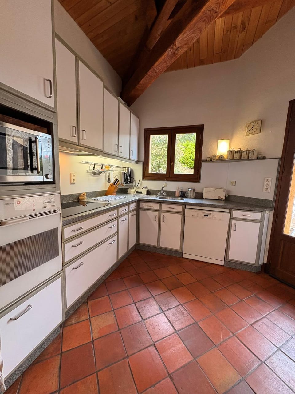 Kitchen or kitchenette, dishwasher, oven, stove, toaster