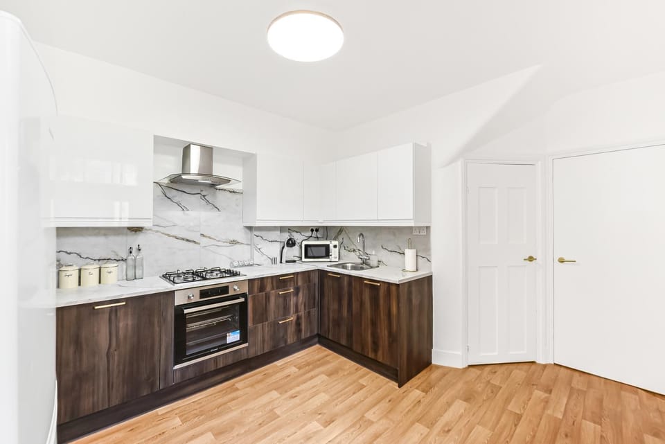 Kitchen or kitchenette, dishwasher, oven, stove, toaster