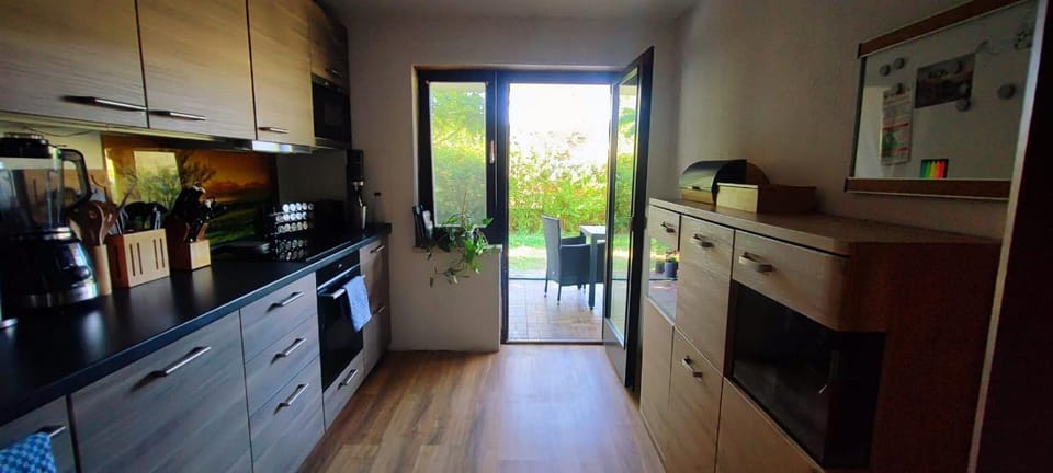 Kitchen or kitchenette, dishwasher, oven, stove