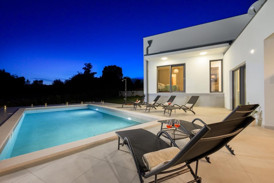 Property building, Night, Pool view, Swimming pool, sunbed