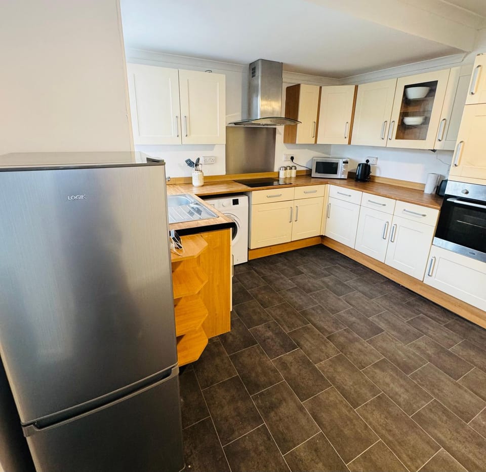 Kitchen or kitchenette, dishwasher, oven, stove, toaster
