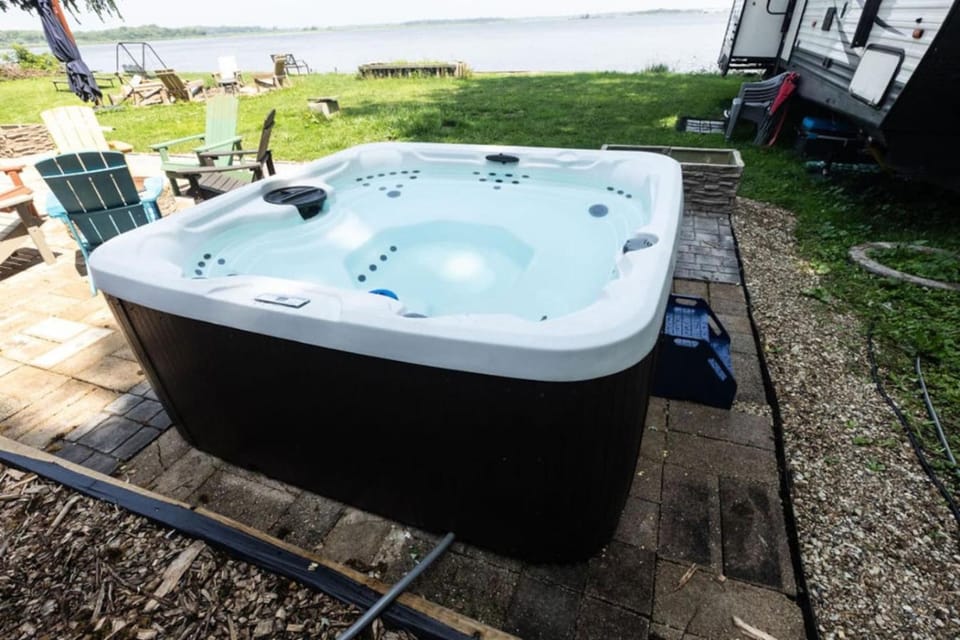 Waterfront 2BR Nautical Cottage on Grass Lake Hot Tub Firepit Year Round Fun Country House in Fox Lake
