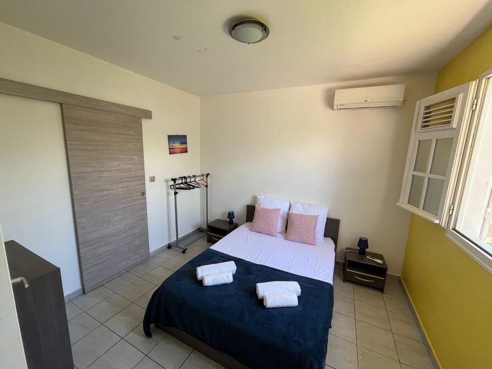 Bed, Photo of the whole room, Bedroom, towels, air conditioner