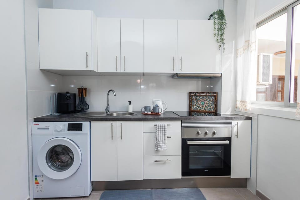 Kitchen or kitchenette, oven, stove, washing machine