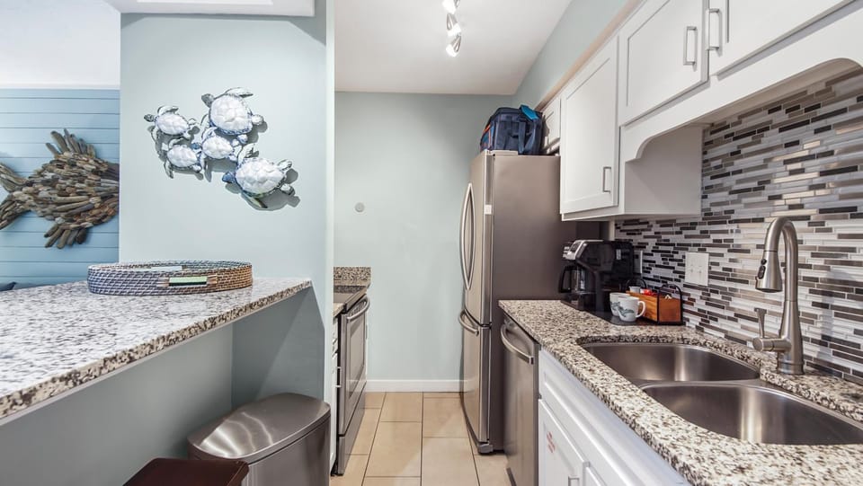 Kitchen or kitchenette, dishwasher, oven, stove