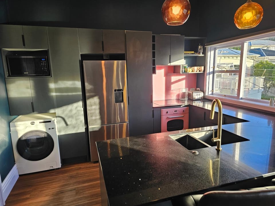 Kitchen or kitchenette, Seating area, Dining area, oven, stove, washing machine, dryer