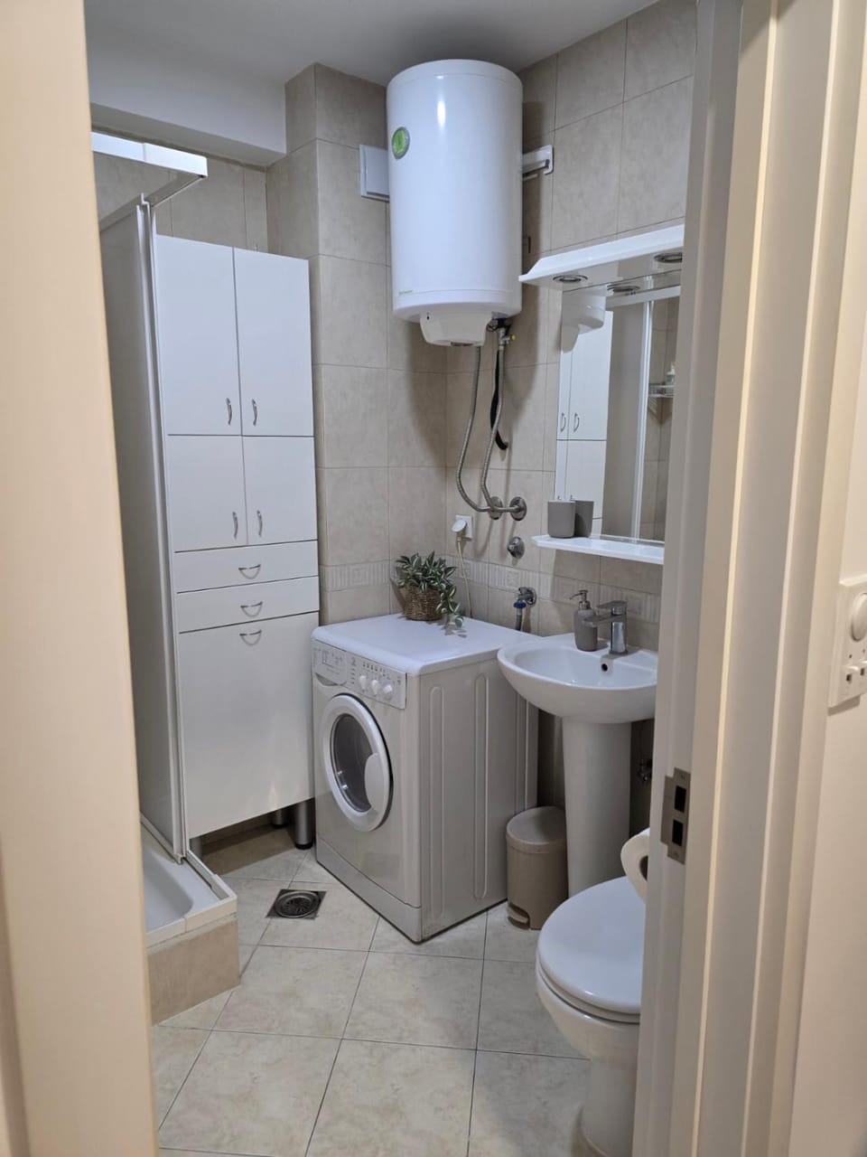 Shower, Toilet, Bathroom, towels, washing machine, dryer