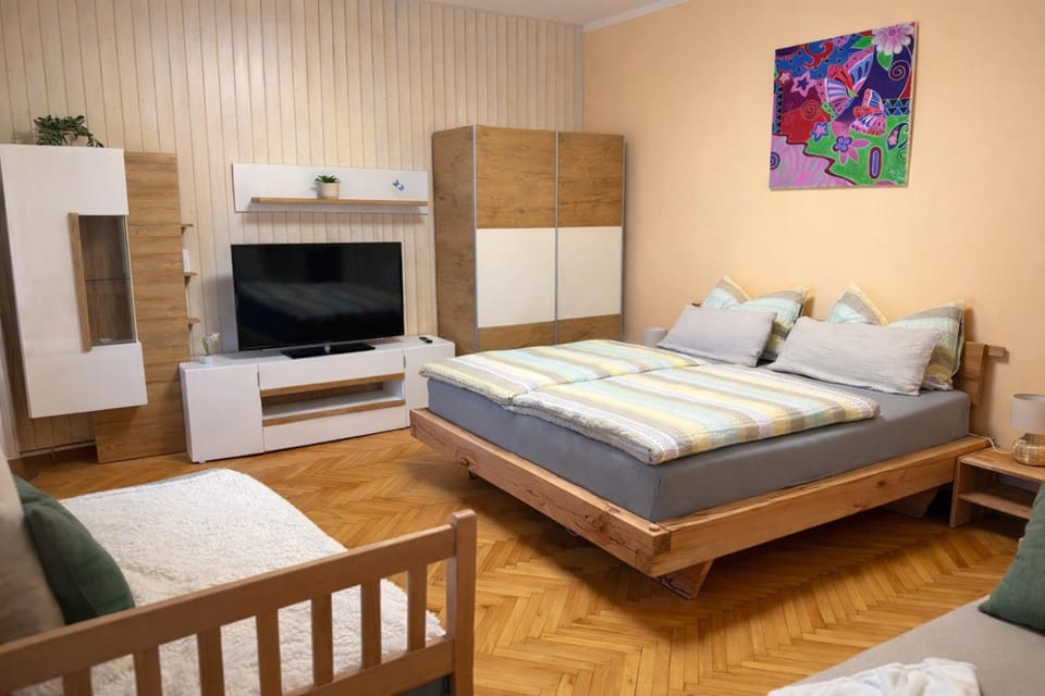 Communal lounge/ TV room, Bed, Living room, Seating area, Bedroom