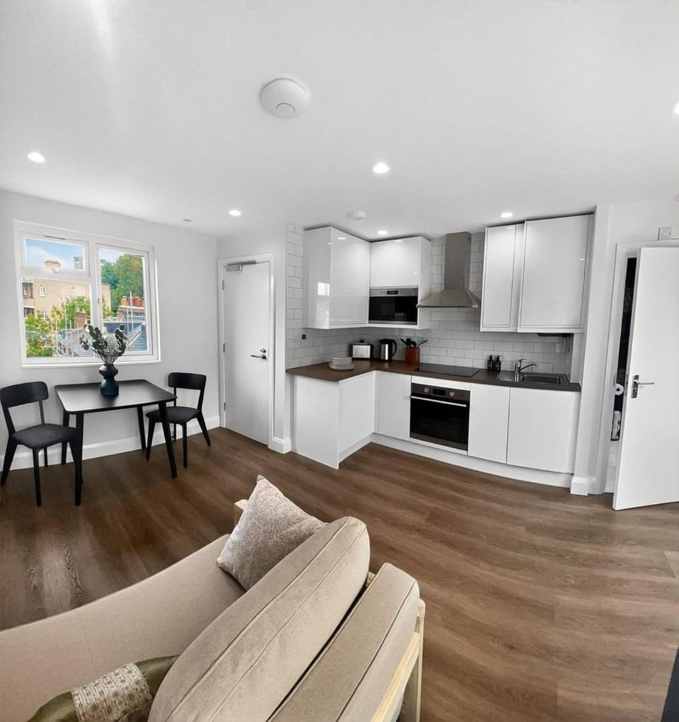 Kitchen or kitchenette, Living room, Seating area, Dining area, microwave, oven, storage, stove, toaster