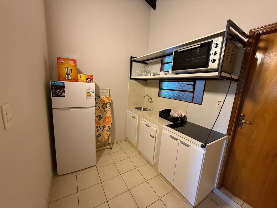 Kitchen or kitchenette, flat iron, minibar, oven, stove, trouser press