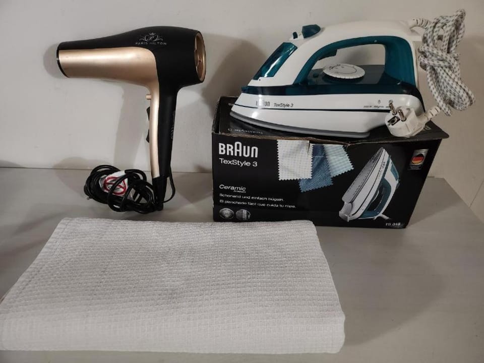flat iron, hair dryier, towels, towels