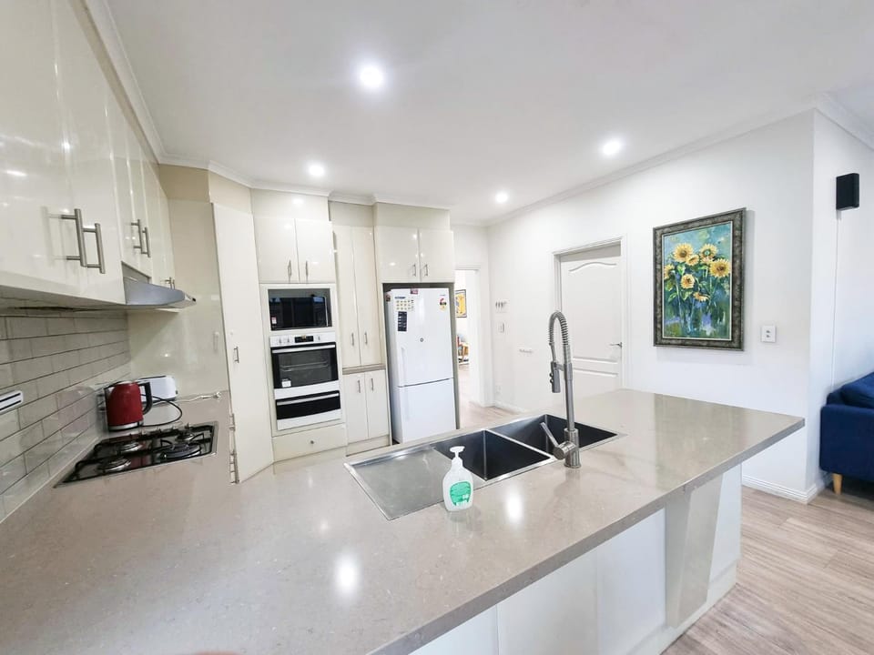 Kitchen or kitchenette, dishwasher, oven, stove