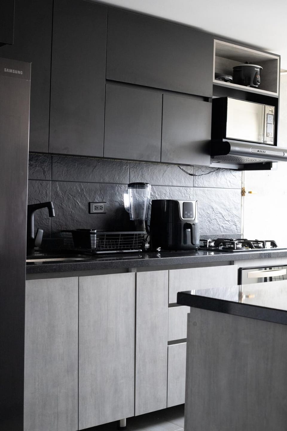 Kitchen or kitchenette, dishwasher, stove, toaster