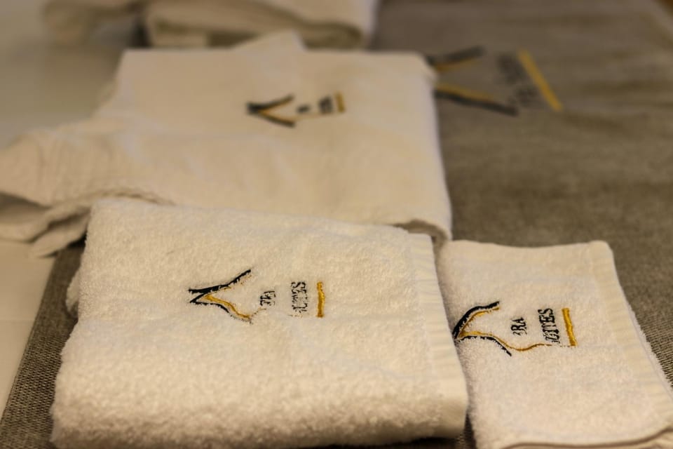 Property logo or sign, Bathroom, Decorative detail, towels