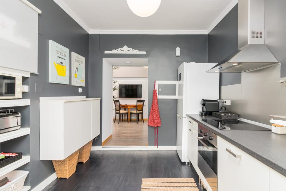 Kitchen or kitchenette, dishwasher, oven, stove, toaster