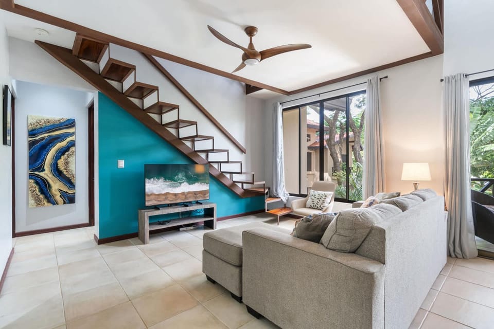 Modern Island-Themed Condo with Floor-to-Ceiling Windows & Garden and Pool Views Within Walking Distance of the Beach House in Coco