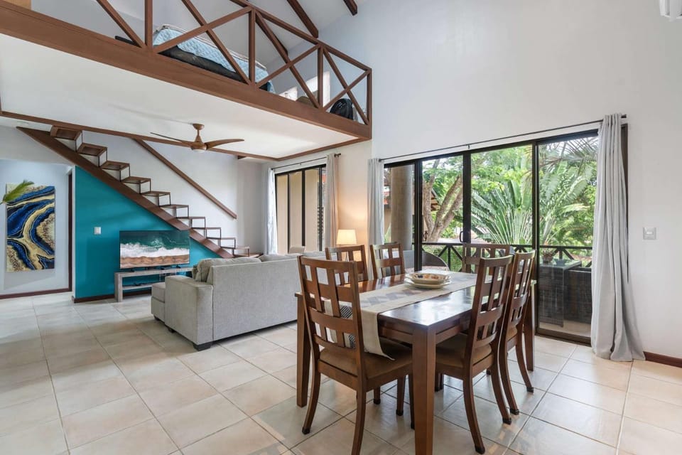 Modern Island-Themed Condo with Floor-to-Ceiling Windows & Garden and Pool Views Within Walking Distance of the Beach House in Coco