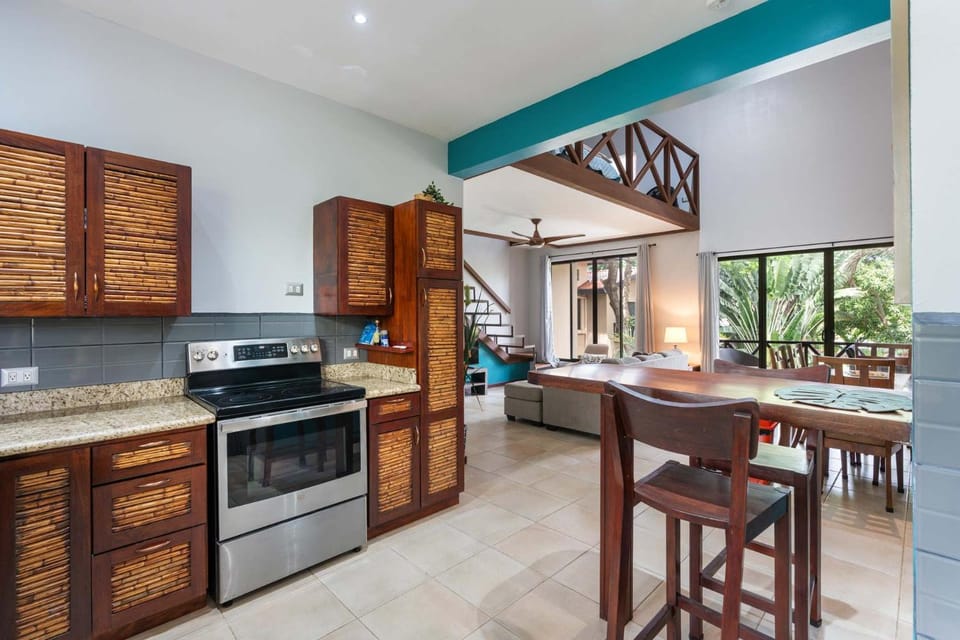 Modern Island-Themed Condo with Floor-to-Ceiling Windows & Garden and Pool Views Within Walking Distance of the Beach House in Coco