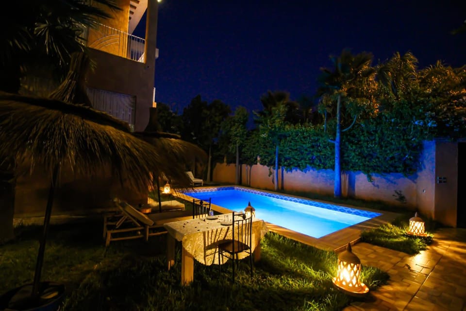 Property building, Patio, Night, Natural landscape, Garden, Garden view, Pool view, Swimming pool, sunbed