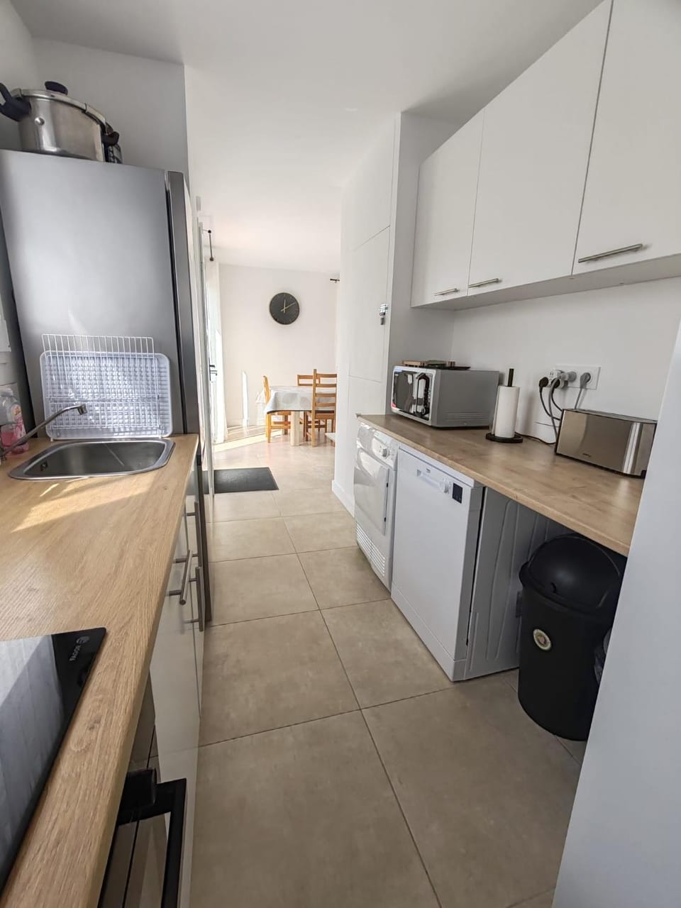 Kitchen or kitchenette, dishwasher, oven, stove, toaster