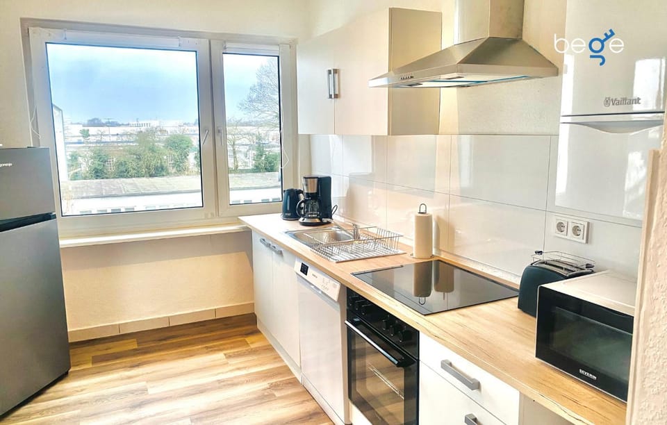 Kitchen or kitchenette, dishwasher, oven, stove, toaster