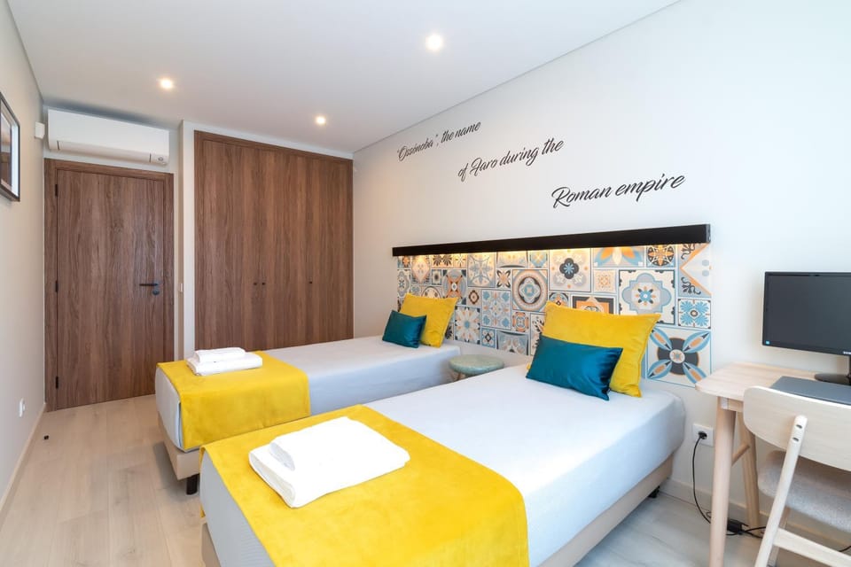 Bed, Photo of the whole room, Seating area, Bedroom, towels, wardrobe, air conditioner