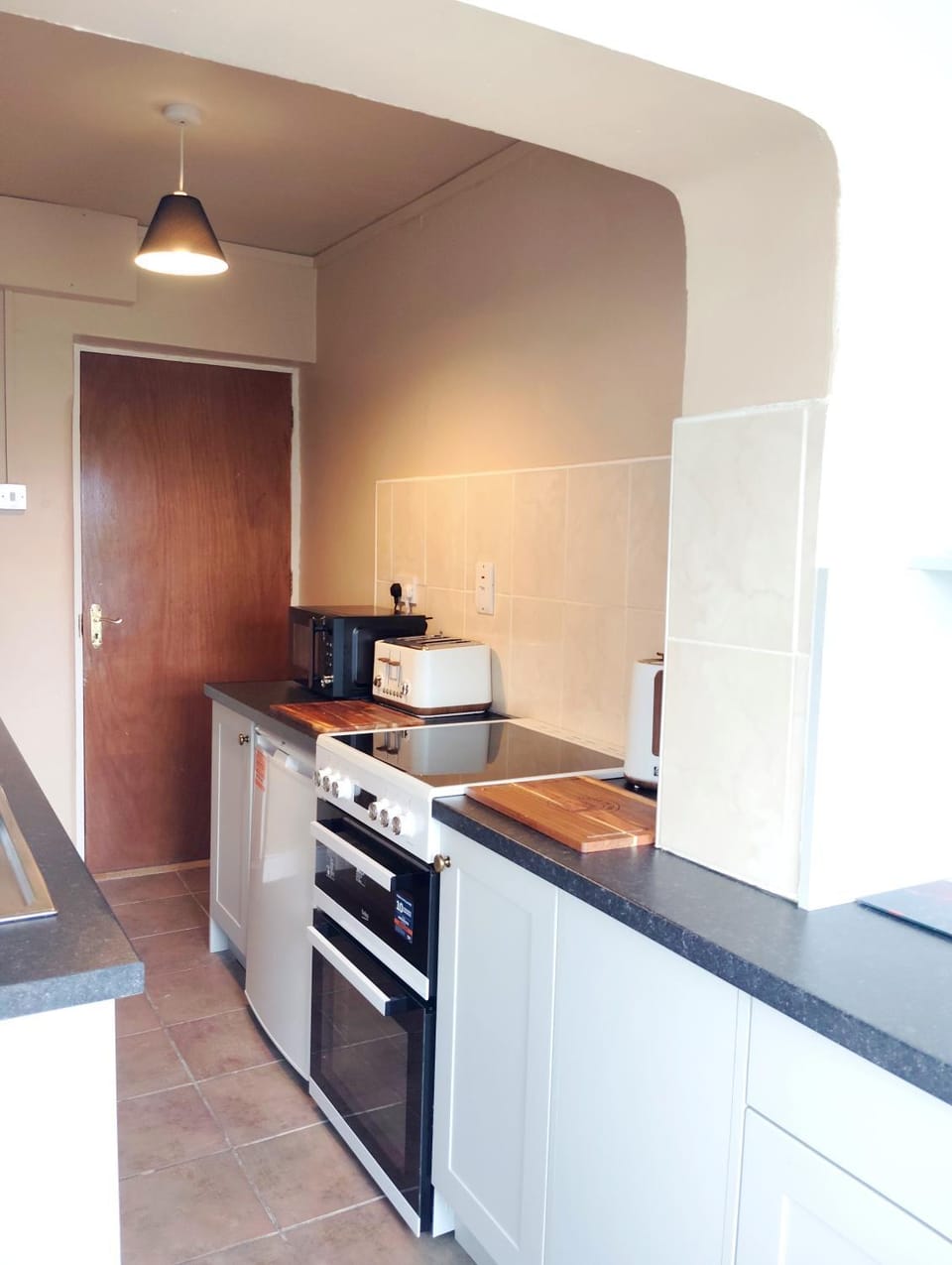 Kitchen or kitchenette, microwave, oven, stove, toaster