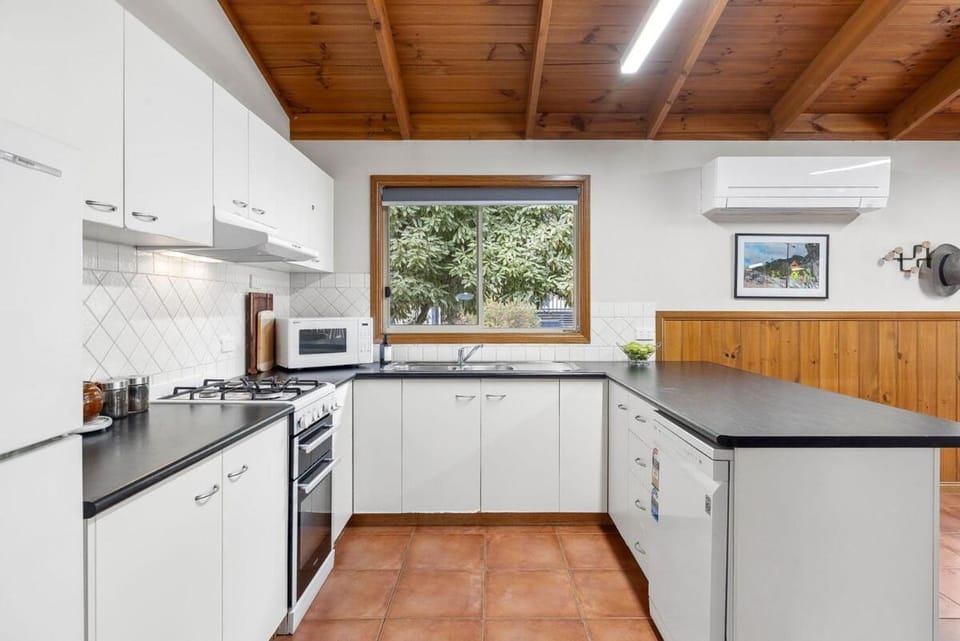 Kitchen or kitchenette, dishwasher, oven, stove, toaster