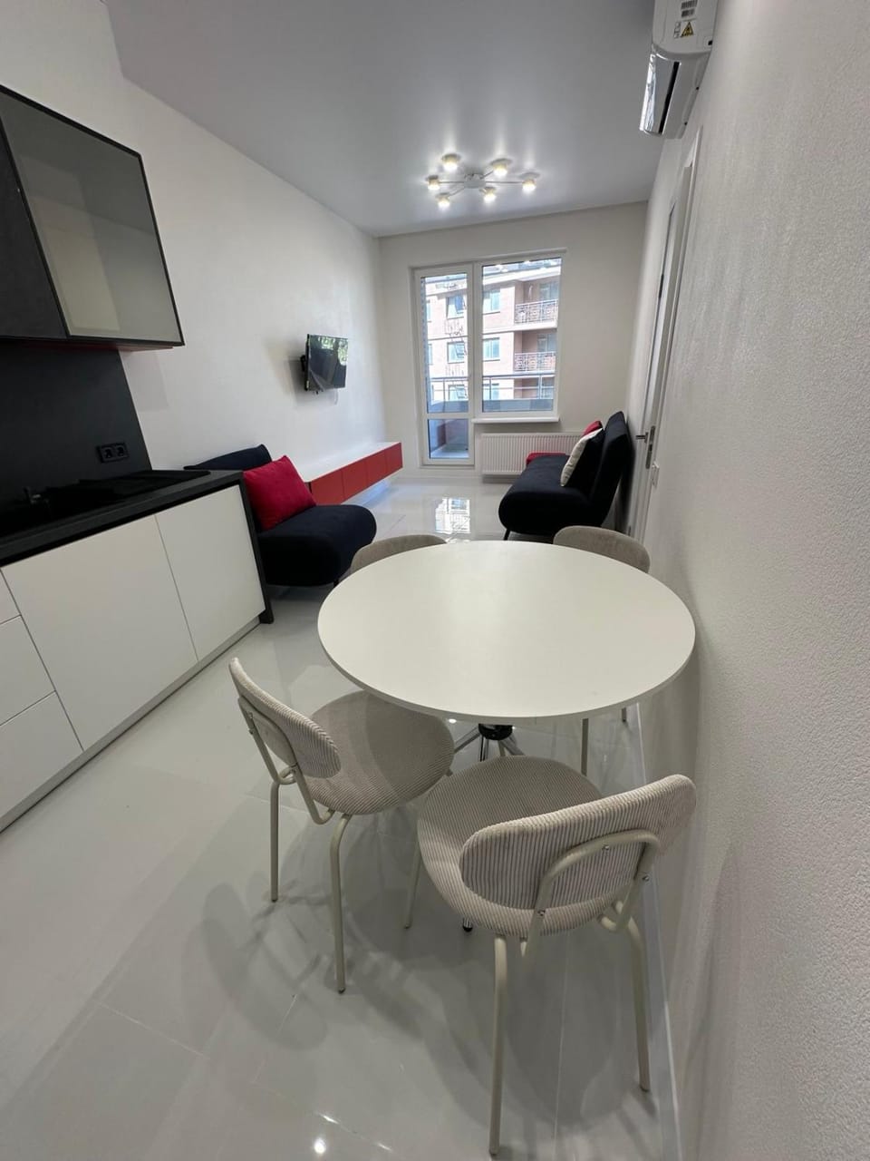 TV and multimedia, Balcony/Terrace, Kitchen or kitchenette, Living room, Seating area, Dining area, microwave, stove, kitchen, air conditioner