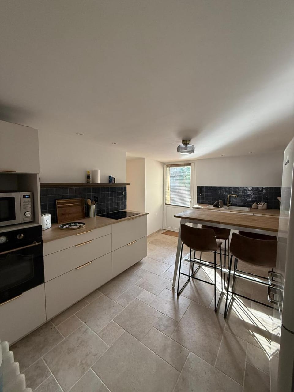 Kitchen or kitchenette, dishwasher, oven, stove, toaster