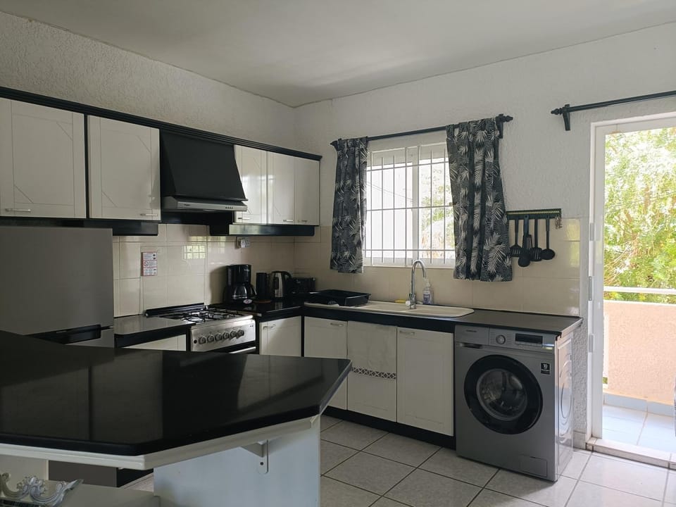 Kitchen or kitchenette, oven, stove, washing machine