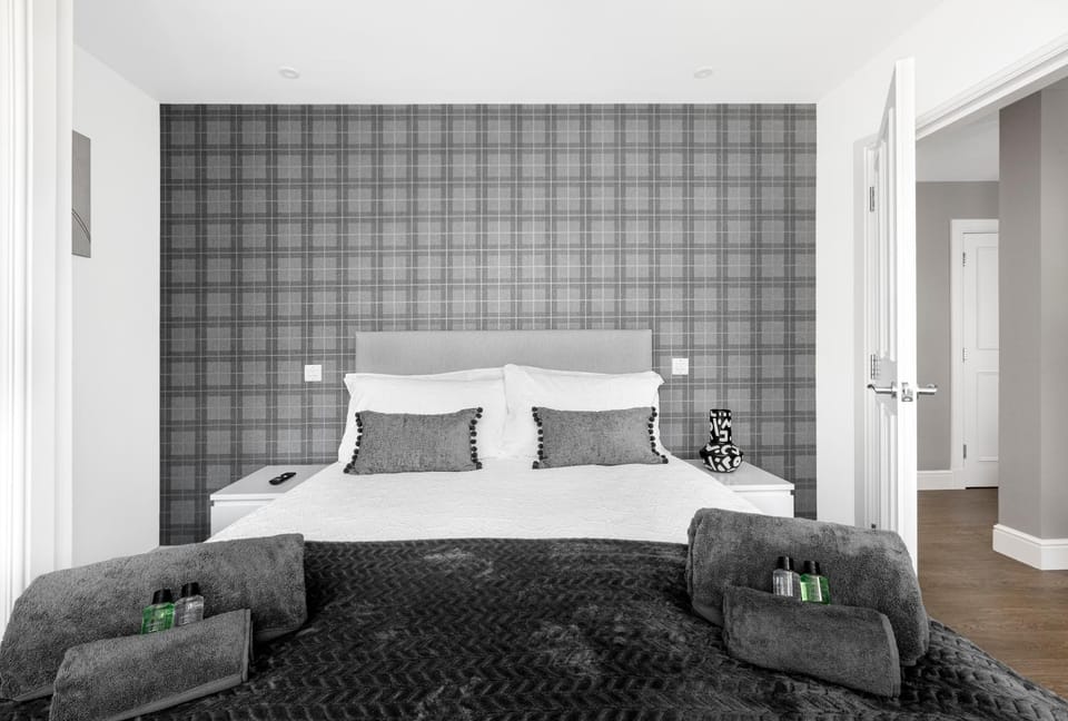 Bed, Photo of the whole room, Bedroom, hair dryier, towels, wardrobe