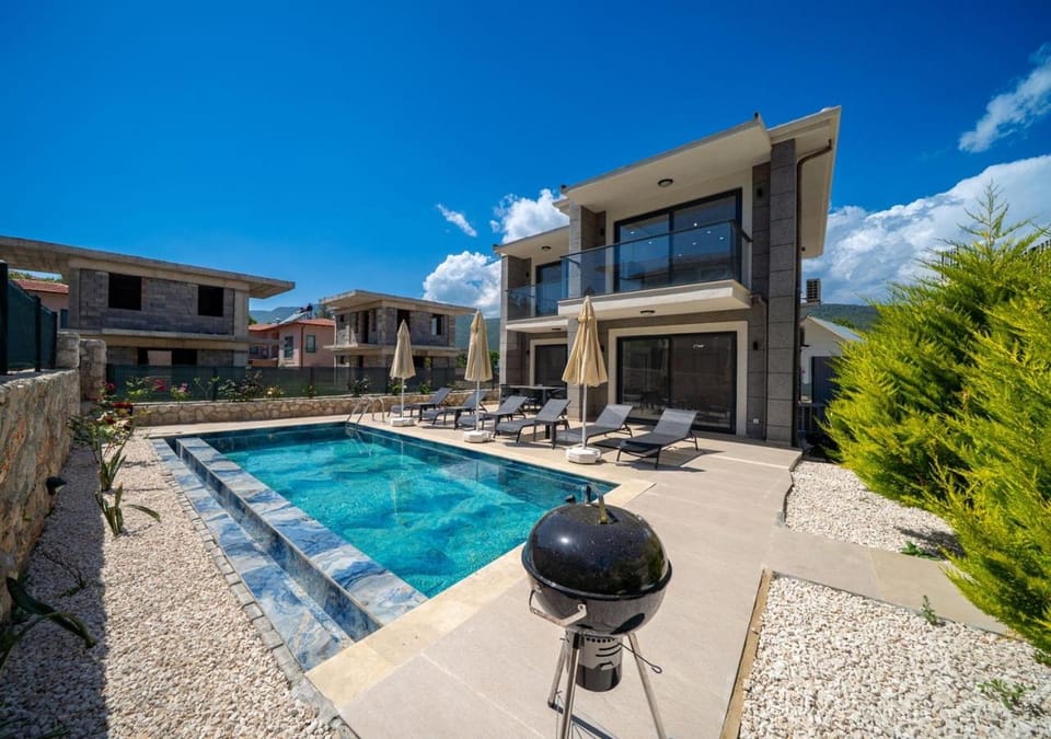 Property building, Patio, Pool view, Swimming pool, sunbed