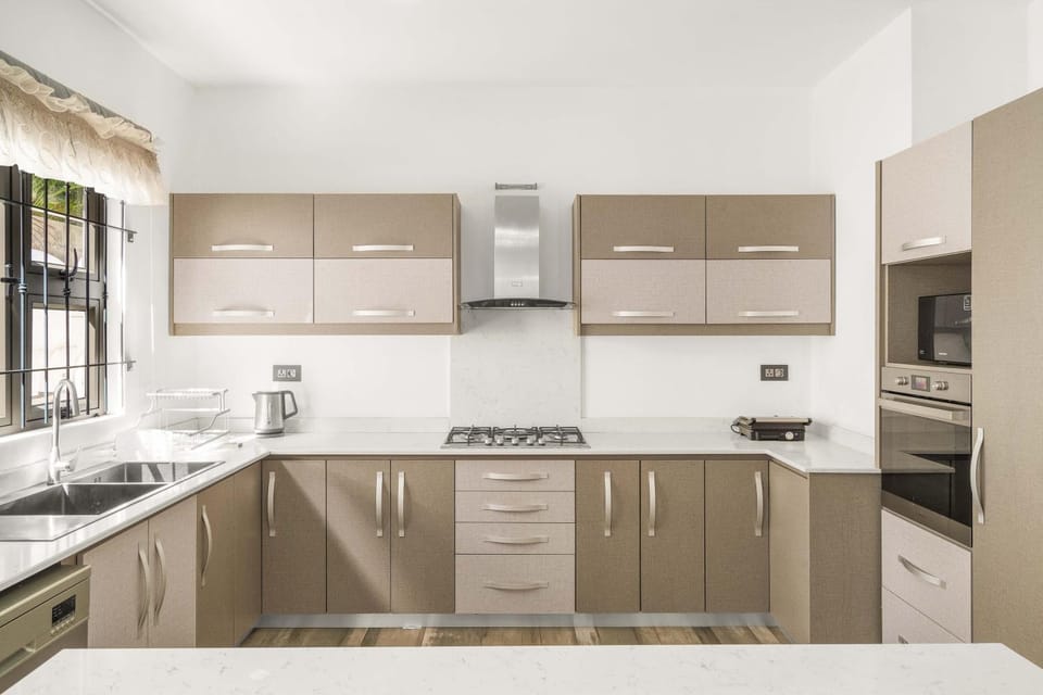 Kitchen or kitchenette, dishwasher, oven, stove