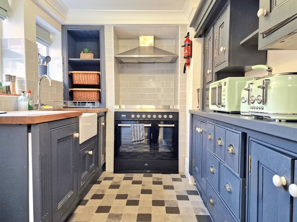 Kitchen or kitchenette, dishwasher, microwave, stove, toaster, toaster