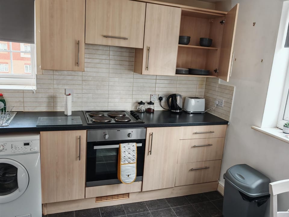 Kitchen or kitchenette, stove, toaster